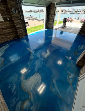 Blue metallic epoxy garage floor overlooking a waterfront
