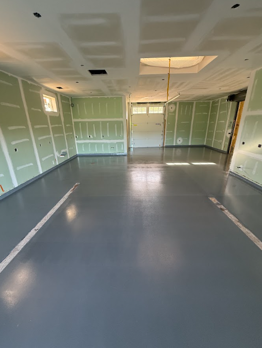 Gray epoxy garage floor in a new-construction home